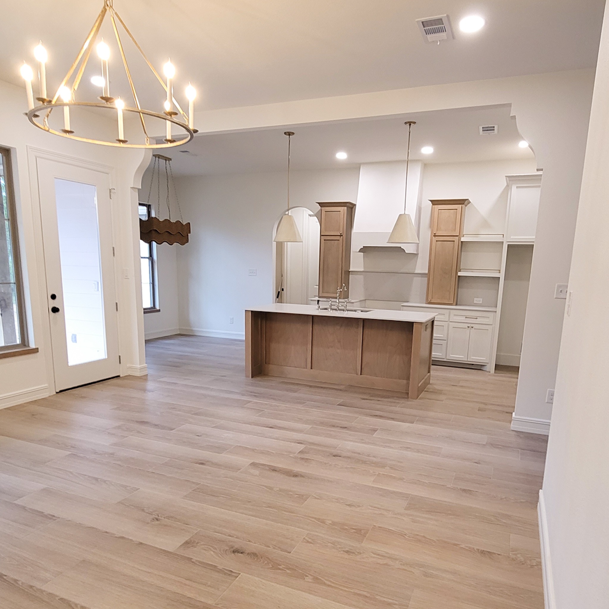6202 Johnson Road Orange, TX 77632 - Photo 7 of 26 a view of a kitchen with cabinets and wooden floor