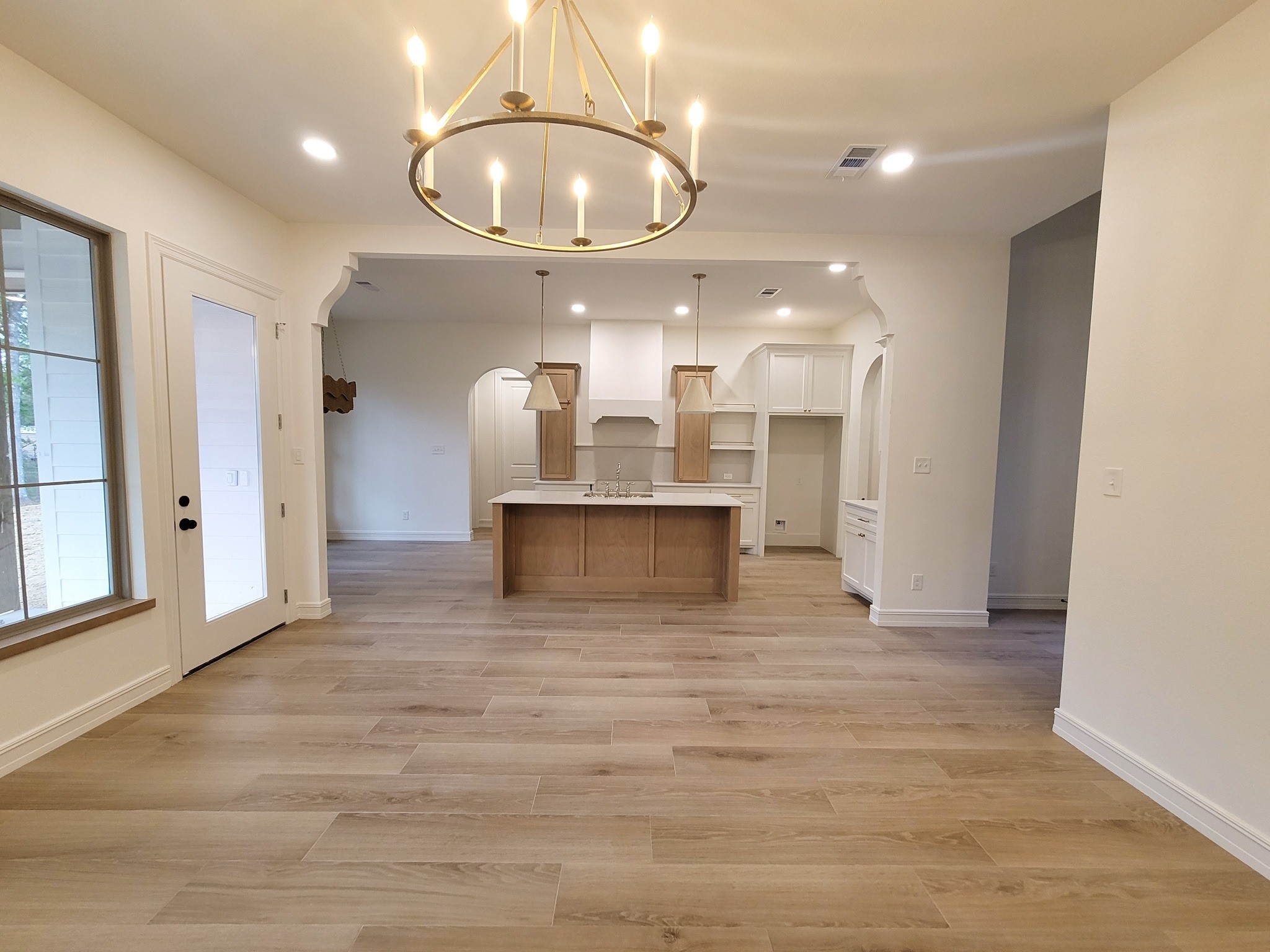 6202 Johnson Road Orange, TX 77632 - Photo 10 of 26 a view of a kitchen with a sink and chandelier