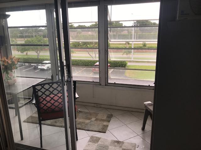 77 Preston F Boca Raton, FL 33434 - Photo 16 of 17 ENCLOSED PATIO VIEW FROM MASTER