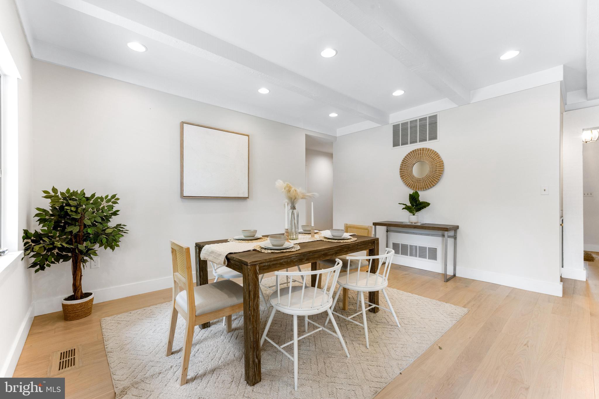 5 Tall Tree Court Baltimore, MD 21208 - Photo 16 of 78 a view of a dining room with furniture and a potted plant
