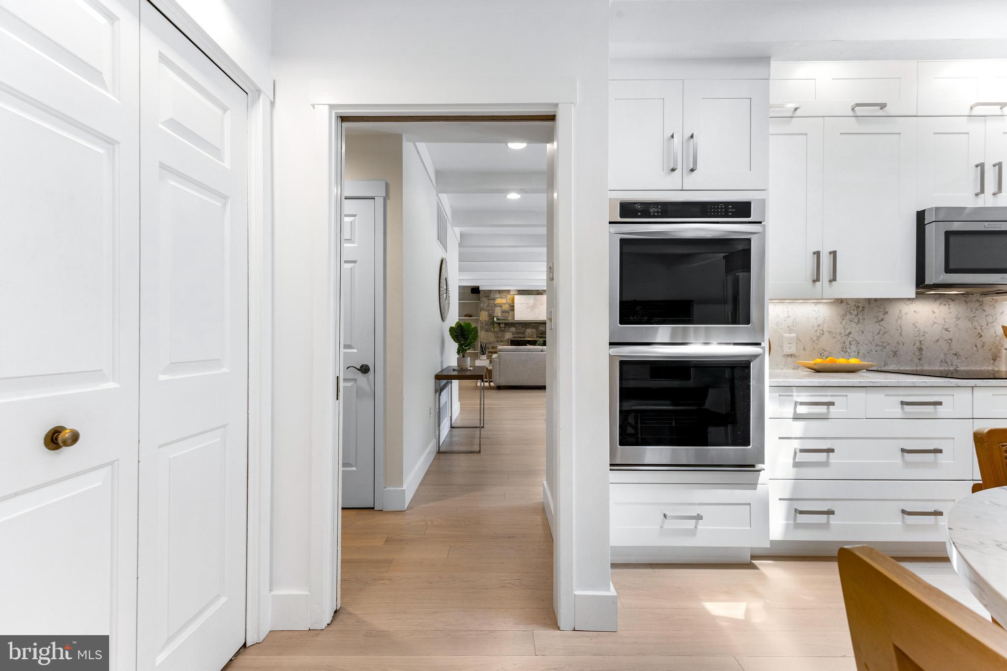5 Tall Tree Court Baltimore, MD 21208 - Photo 18 of 78 a kitchen with cabinets and stainless steel appliances
