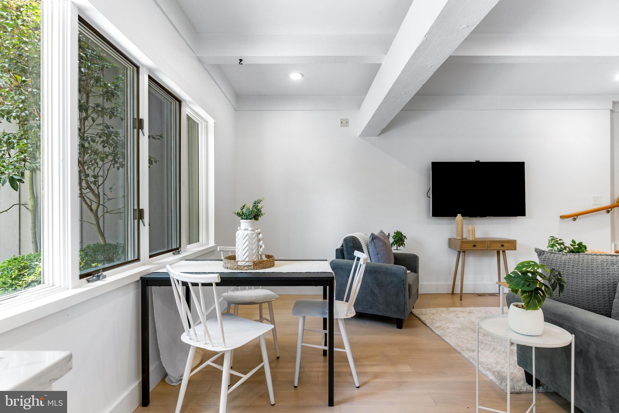 5 Tall Tree Court Baltimore, MD 21208 - Photo 33 of 78 a living room with furniture and a flat screen tv