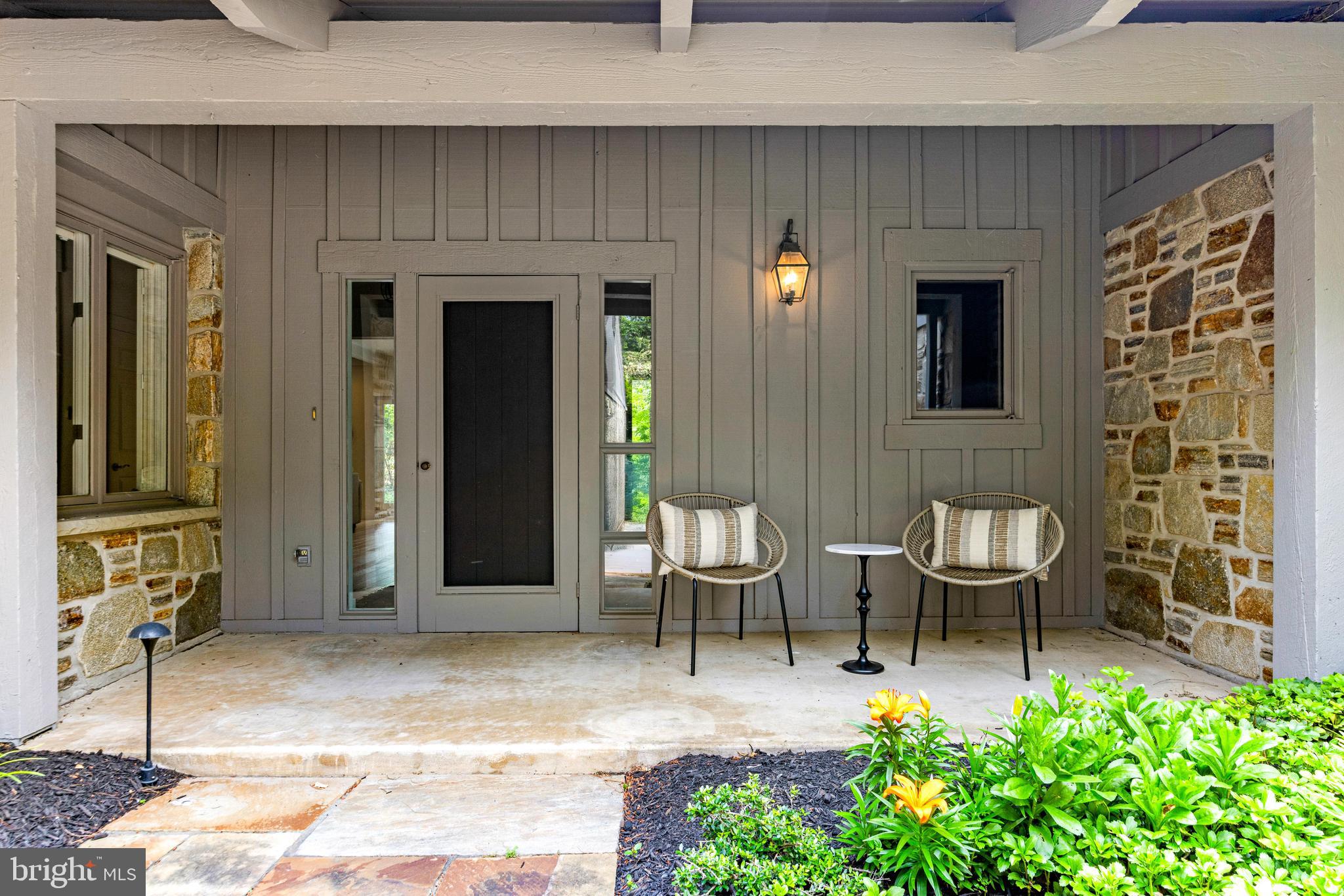 5 Tall Tree Court Baltimore, MD 21208 - Photo 4 of 78 a view of a patio with table and chairs and potted plants