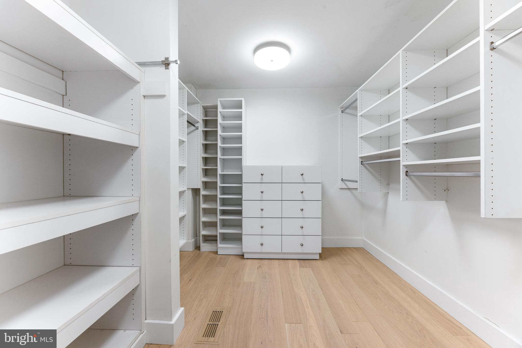 5 Tall Tree Court Baltimore, MD 21208 - Photo 48 of 78 a view of walk in closet with empty racks