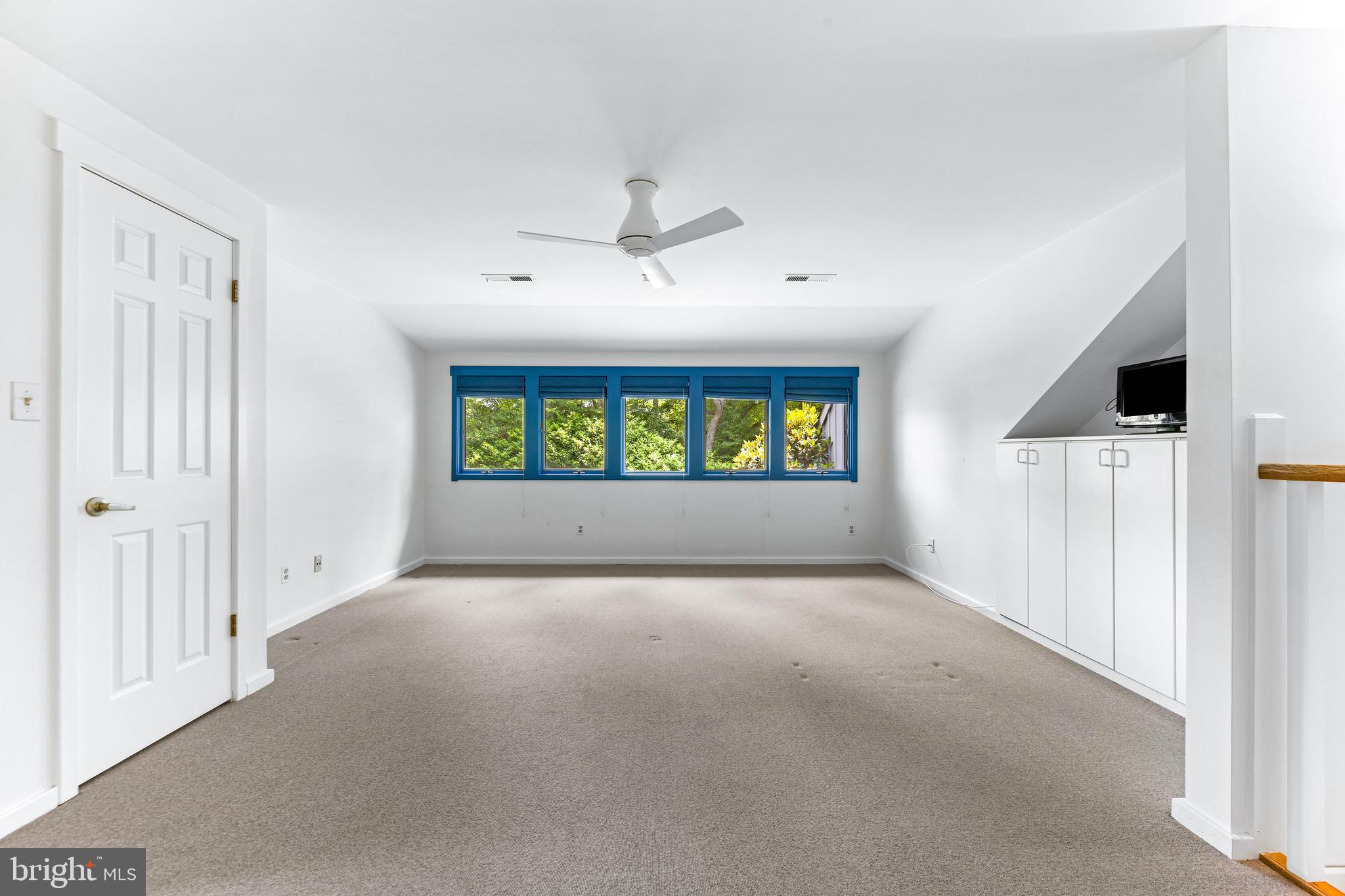 5 Tall Tree Court Baltimore, MD 21208 - Photo 58 of 78 a view of an empty room with a window
