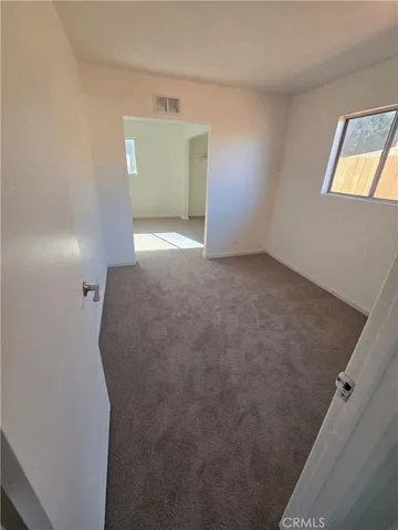 a view of a room with windows