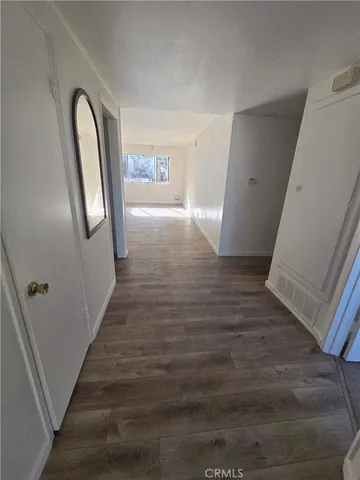 a view of entryway with wooden floor