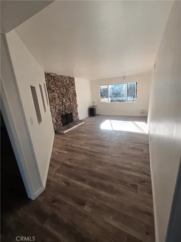 a view of a livingroom with wooden floor