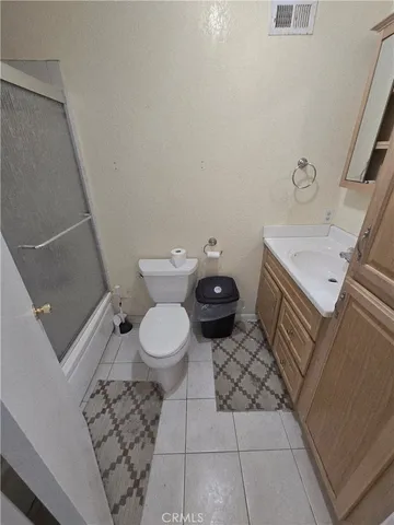 a bathroom with a toilet and a sink