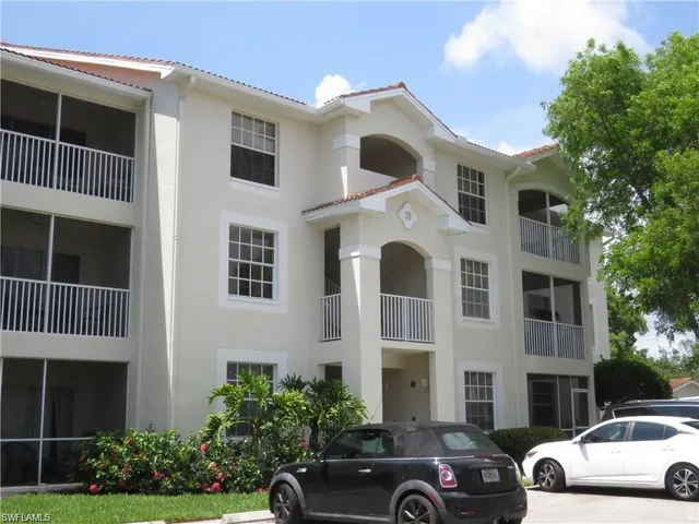 a front view of a house with parking
