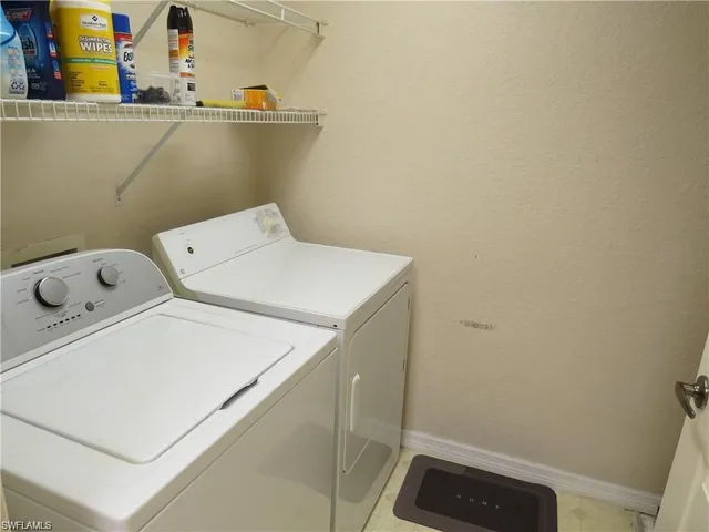 a front view of a house with parking space