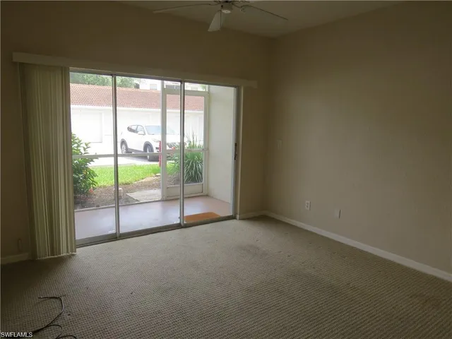 a view of empty room with floor to ceiling window