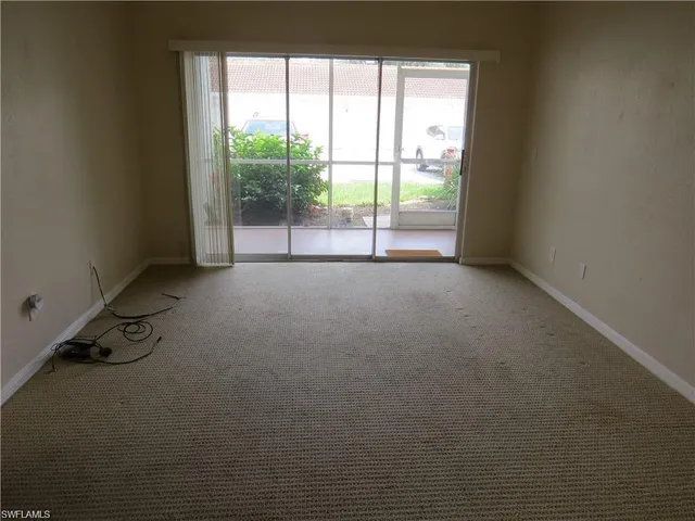 a kitchen with a stove and a refrigerator