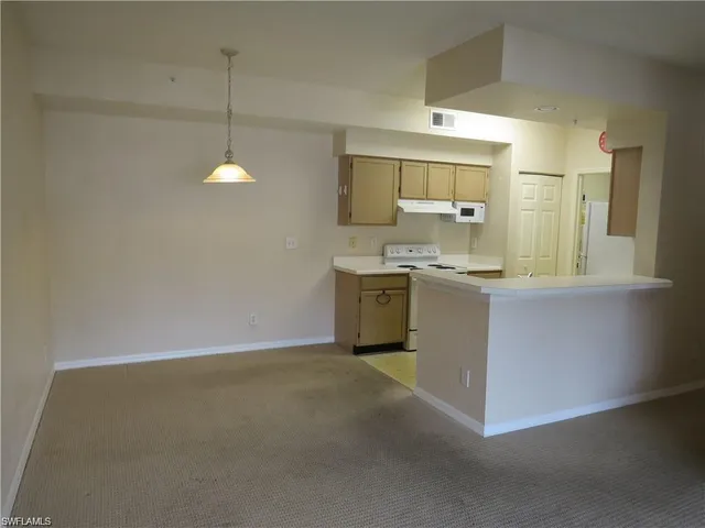 a view of a kitchen with a sink