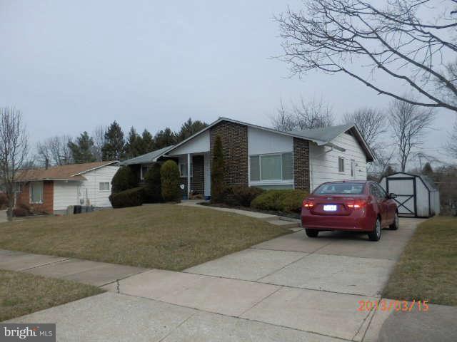 8250 Brattle Road Baltimore, MD 21208 - Photo 1 of 17 a front view of a house with cars parked