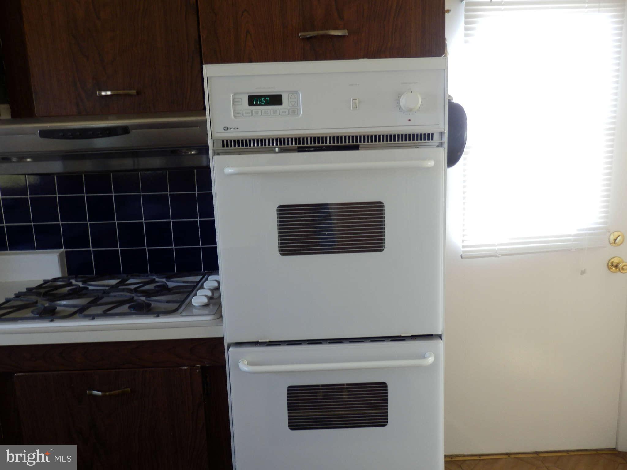 8250 Brattle Road Baltimore, MD 21208 - Photo 11 of 17 a close view of a stove top oven with granite countertops