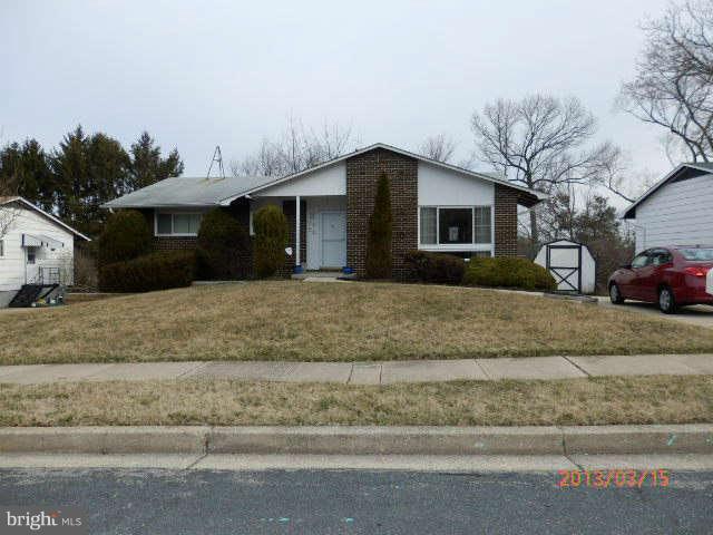 8250 Brattle Road Baltimore, MD 21208 - Photo 3 of 17 a front view of a house with a yard