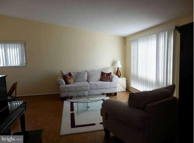 8250 Brattle Road Baltimore, MD 21208 - Photo 5 of 17 a living room with furniture and a window