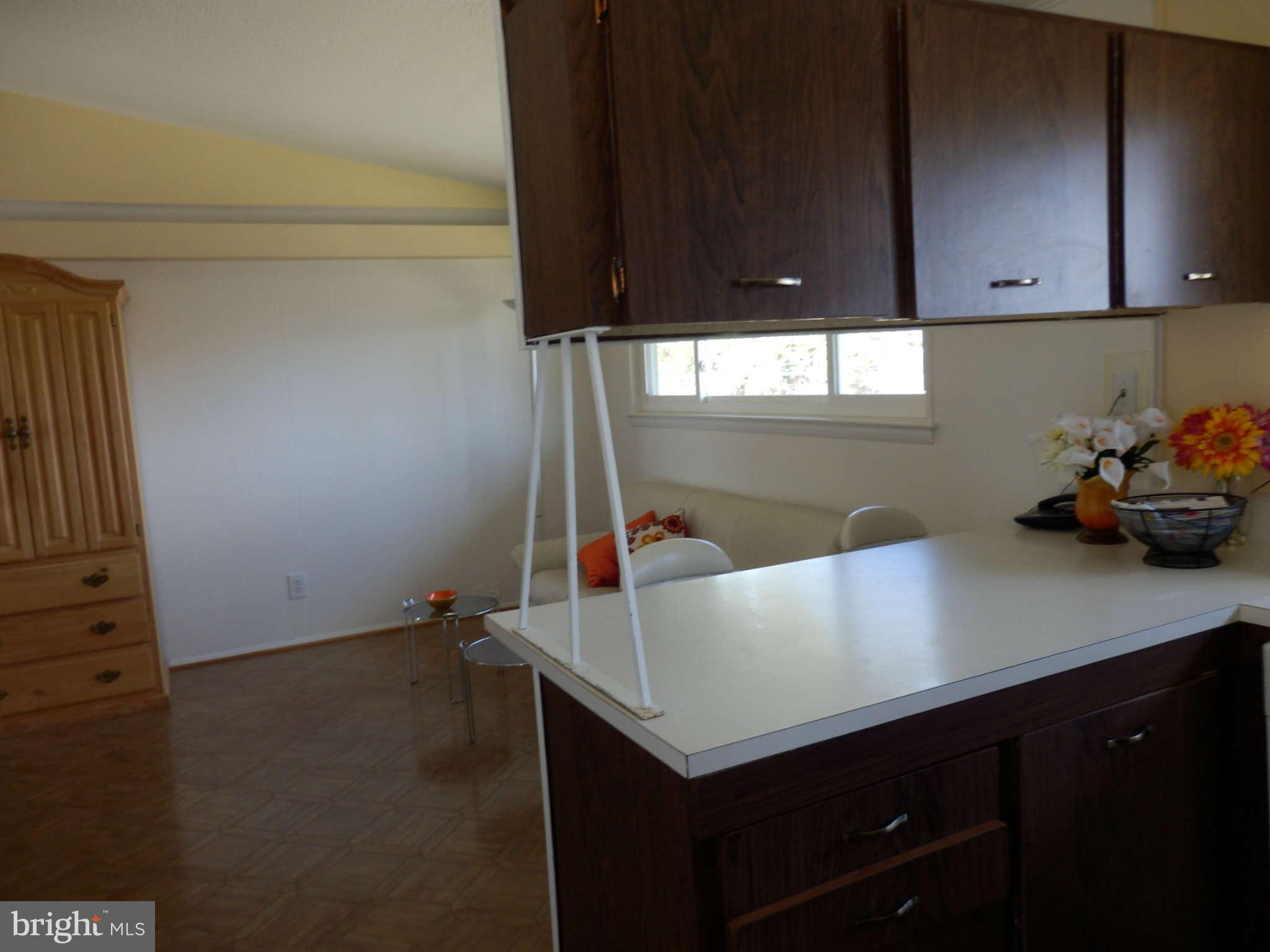 8250 Brattle Road Baltimore, MD 21208 - Photo 7 of 17 a kitchen with a sink and cabinets