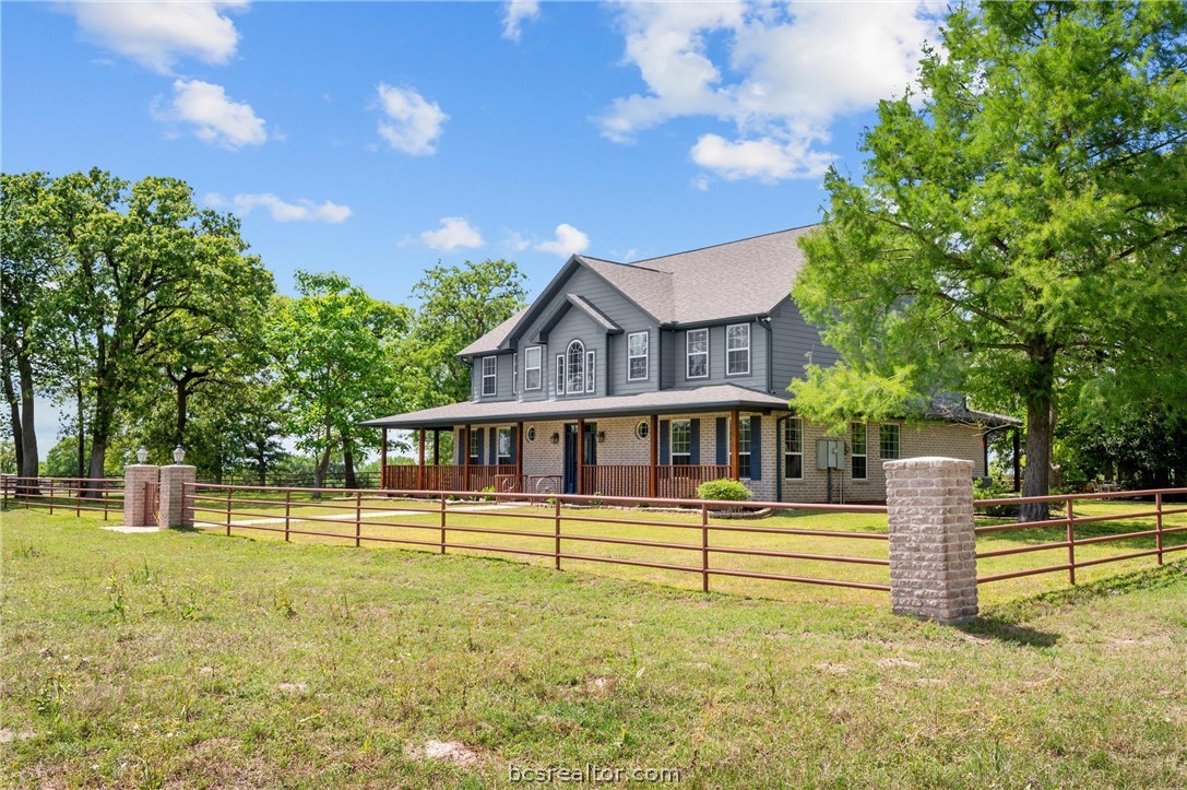 6400 Koppe Bridge Road College Station, TX 77845 - Photo 7 of 47 View of front of home with covered porch and brick siding.