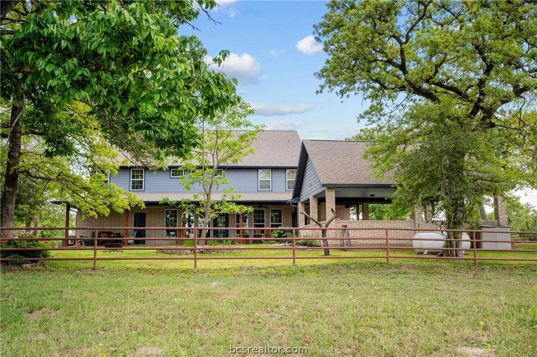 6400 Koppe Bridge Road College Station, TX 77845 - Photo 10 of 47 Rear view of house featuring porte cochere parking.