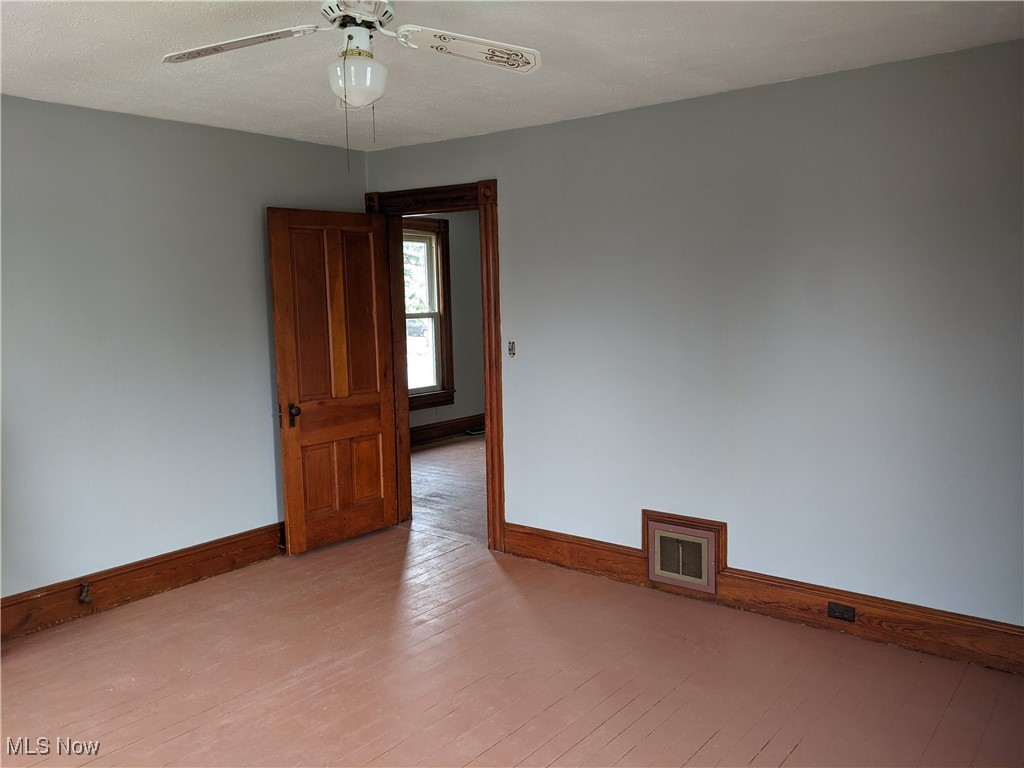 70 Center Road Bedford, OH 44146 - Photo 11 of 18 2nd floor Unfurnished room featuring light hardwood / wood-style flooring and ceiling fan