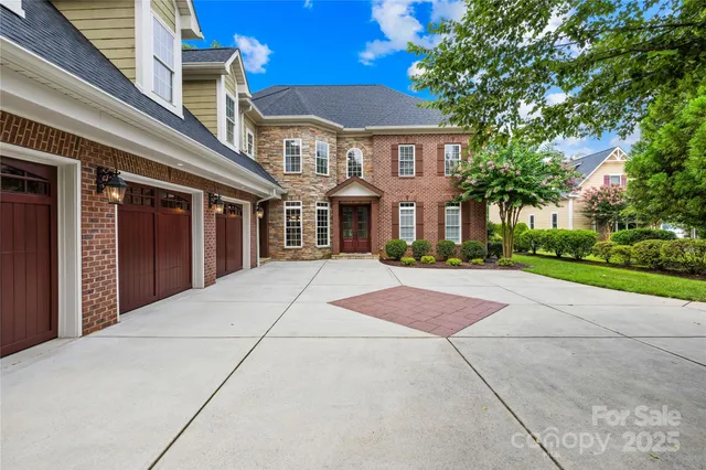 a living room with furniture fireplace and a large window