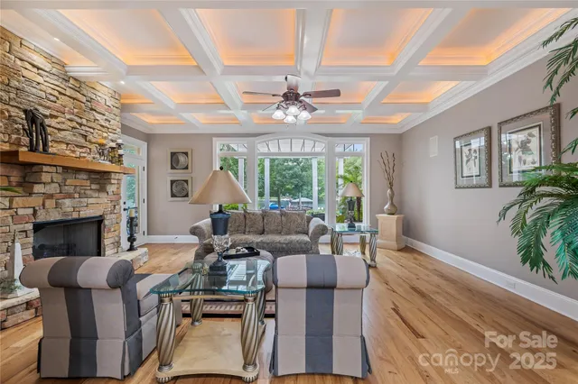a spacious bedroom with a large bed and a chandelier