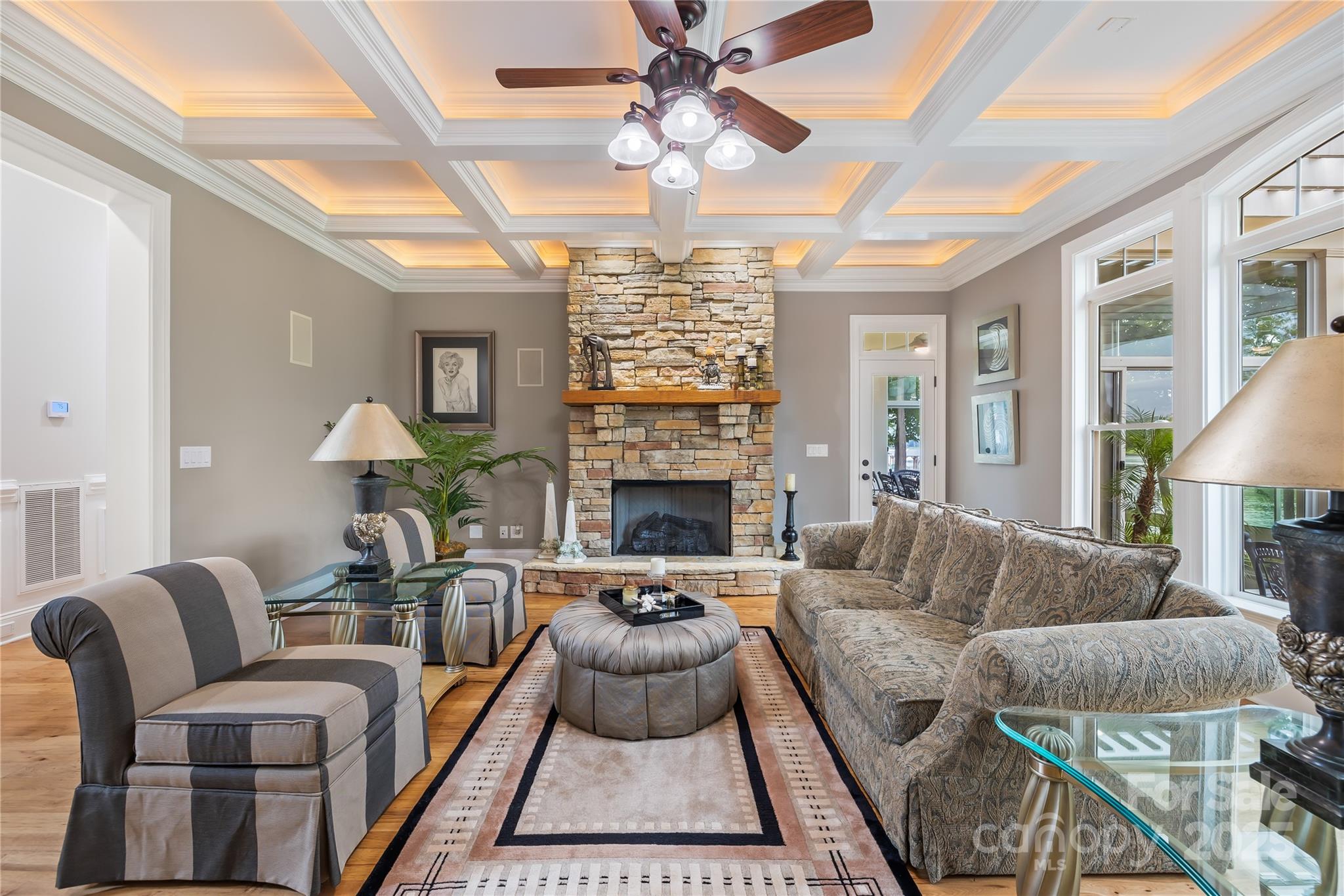 3601 Andover Place Terrell, NC 28682 - Photo 25 of 48 a living room with furniture a chandelier and a fireplace