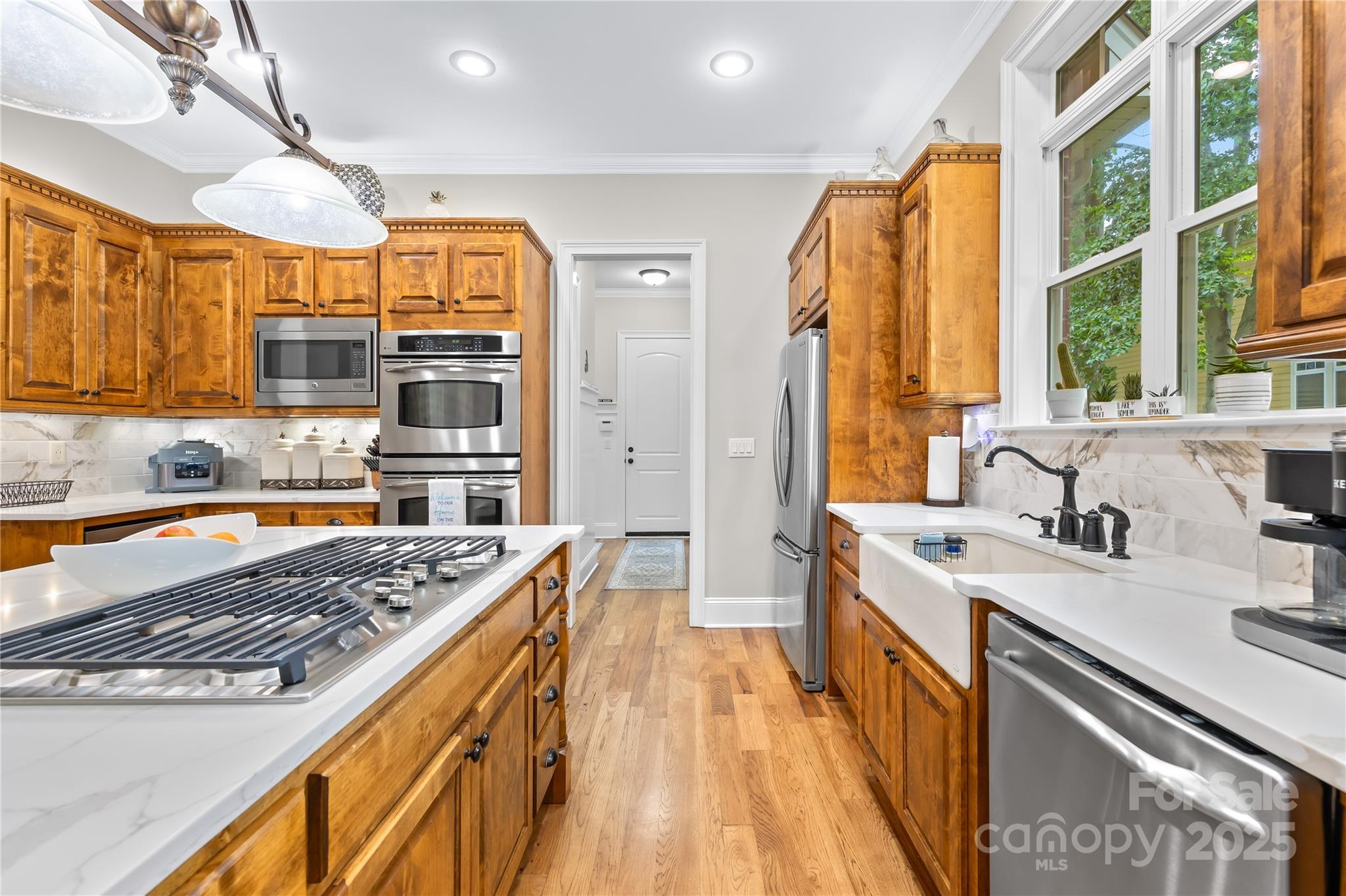 3601 Andover Place Terrell, NC 28682 - Photo 28 of 48 a kitchen with stainless steel appliances granite countertop a sink and a stove