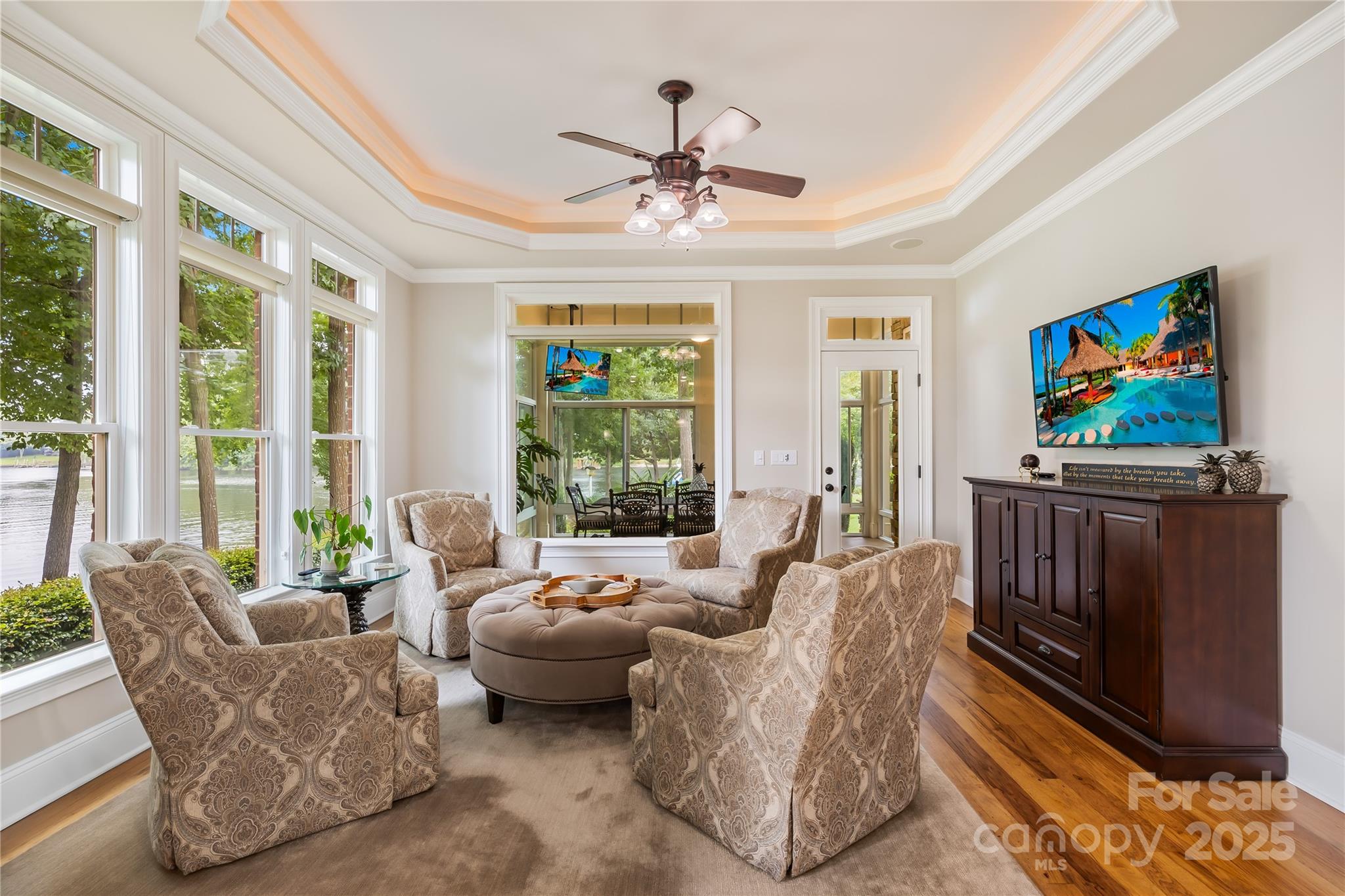 3601 Andover Place Terrell, NC 28682 - Photo 30 of 48 a living room with furniture a flat screen tv and a large window