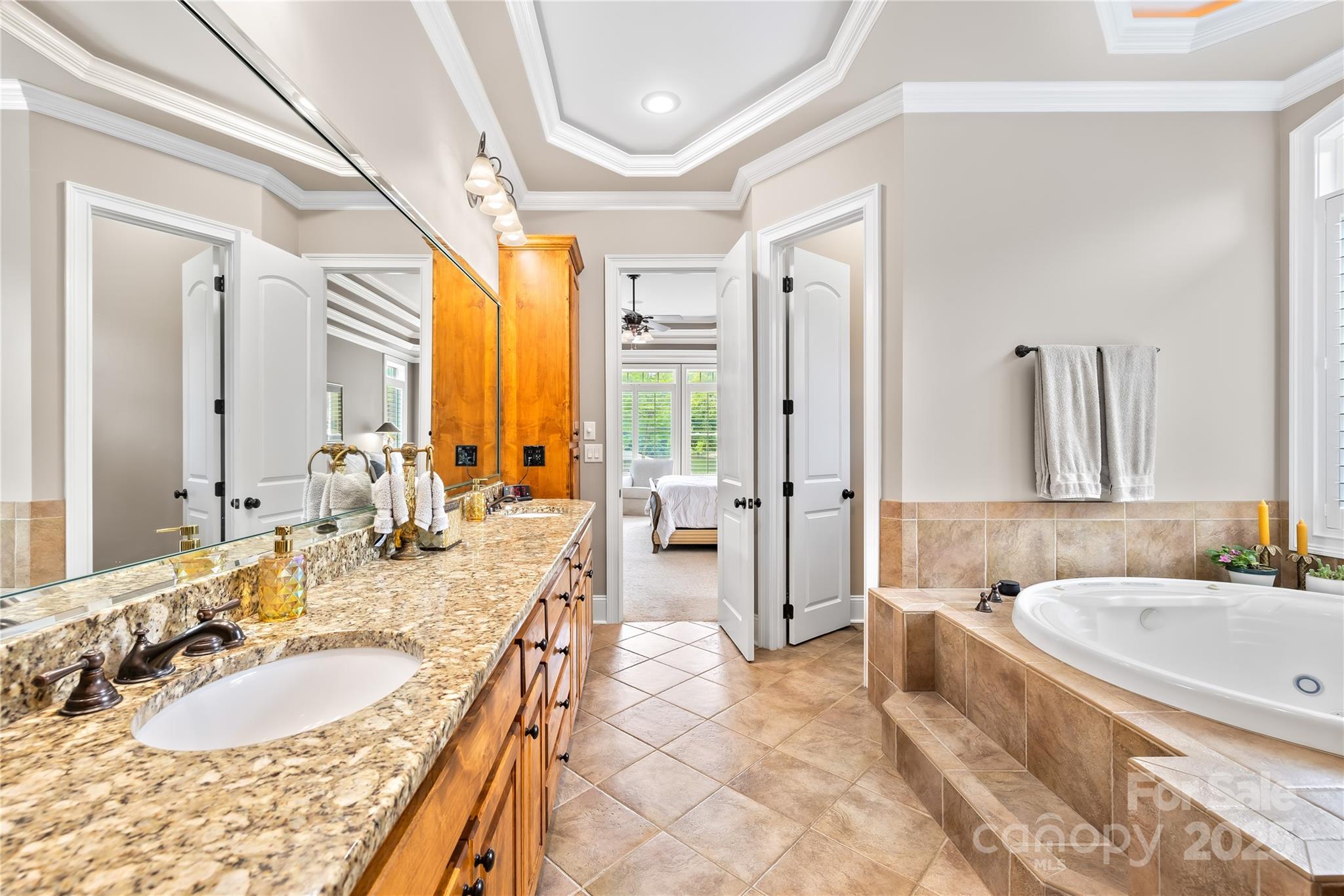 3601 Andover Place Terrell, NC 28682 - Photo 35 of 48 a spacious bathroom with a tub sink and mirror