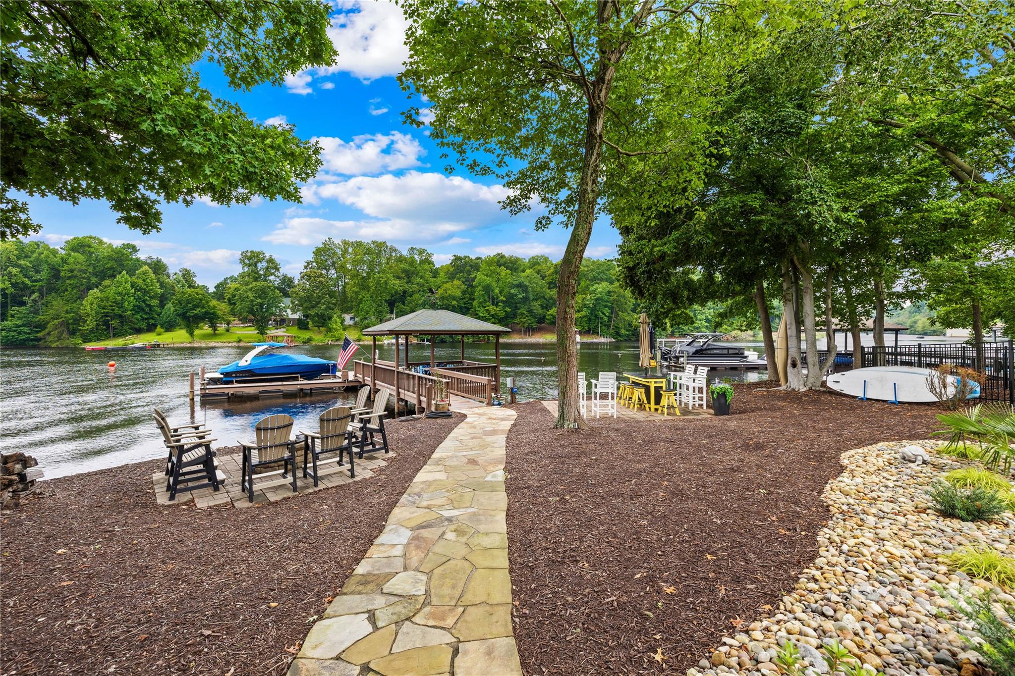 3601 Andover Place Terrell, NC 28682 - Photo 10 of 48 a view of a patio with table and chairs potted plants and a large tree