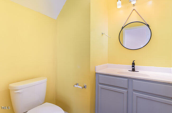 3529 Sunbright Lane Raleigh, NC 27610 - Photo 13 of 30 a bathroom with a sink and a mirror