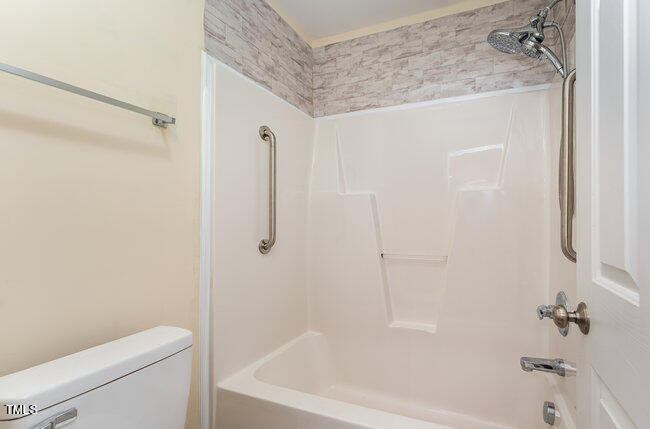 3529 Sunbright Lane Raleigh, NC 27610 - Photo 26 of 30 a bathroom with a bathtub and a shower