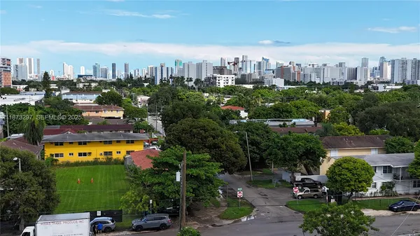 a view of a city with lots of trees