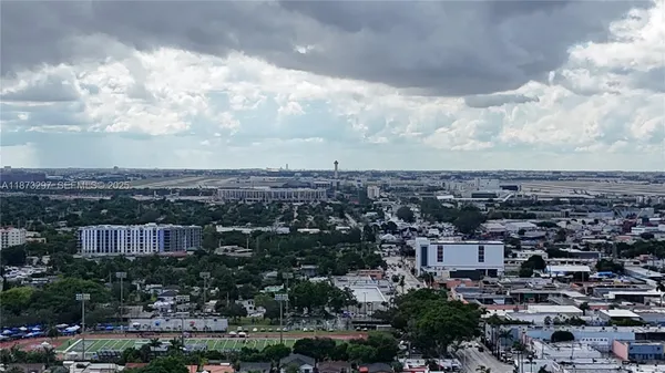 an aerial view of a city with tall buildings