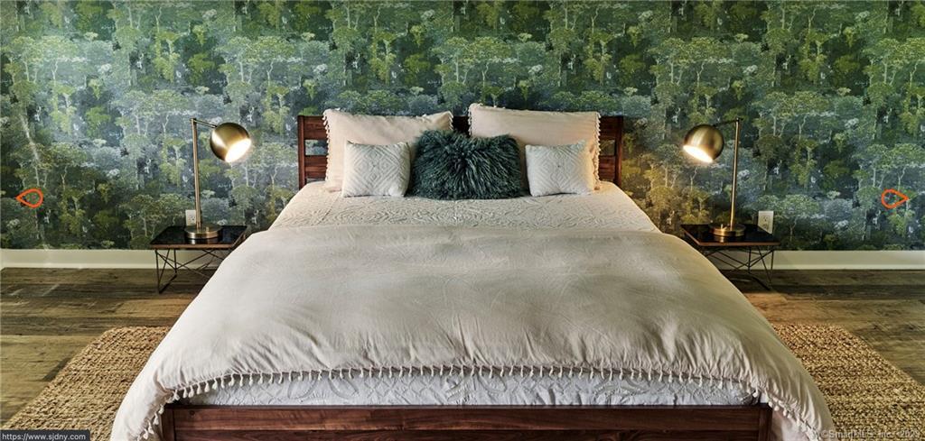 8 Chester Road Warren, CT 06754 - Photo 11 of 28 a bed sitting in a bedroom next to a yard