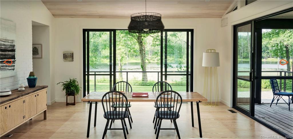8 Chester Road Warren, CT 06754 - Photo 13 of 28 a view of a dining room with furniture window and wooden floor