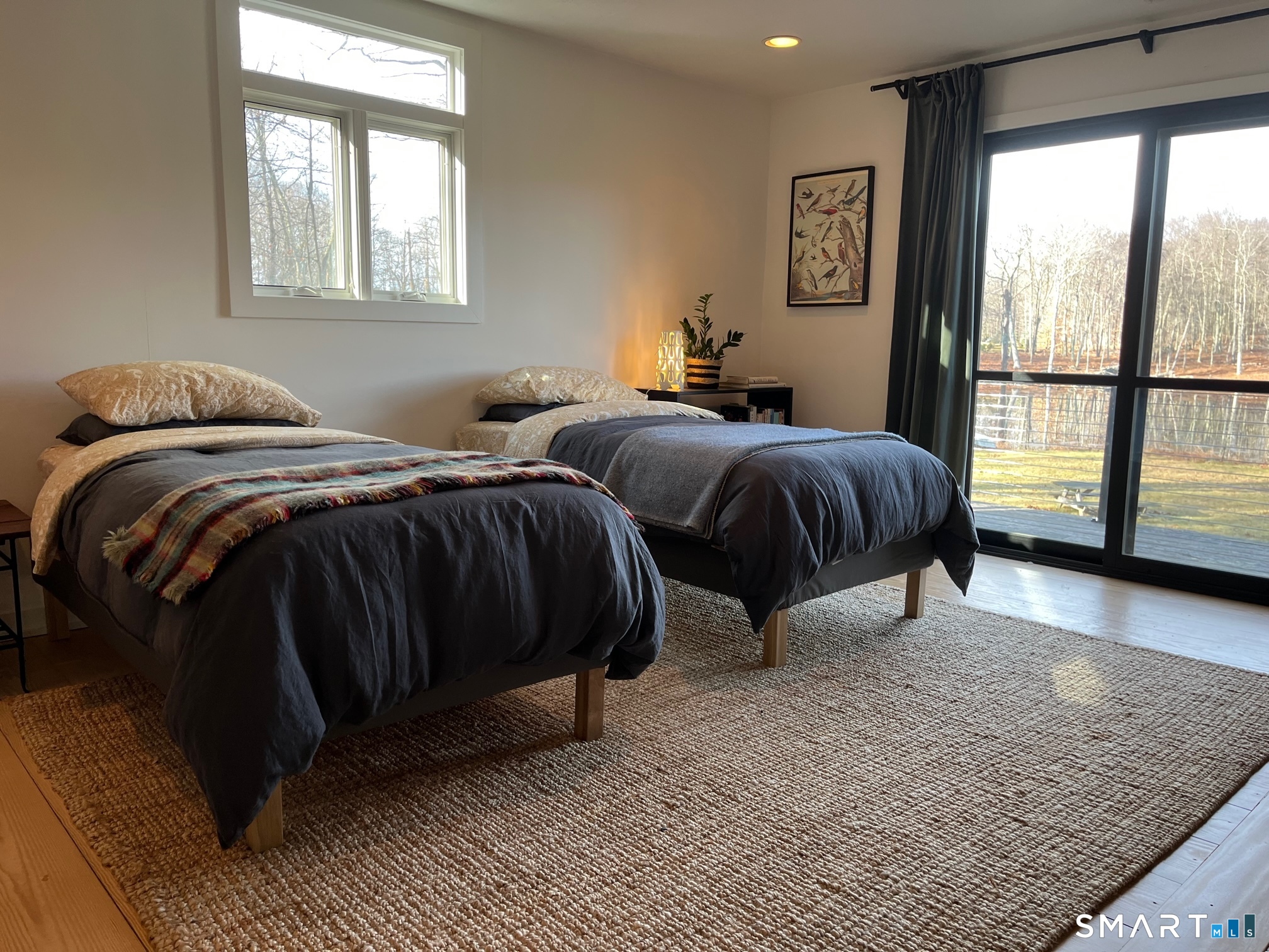 8 Chester Road Warren, CT 06754 - Photo 16 of 28 a bedroom with a bed and glass window