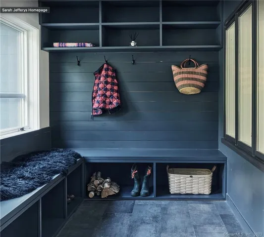 a room with furniture and wall painting