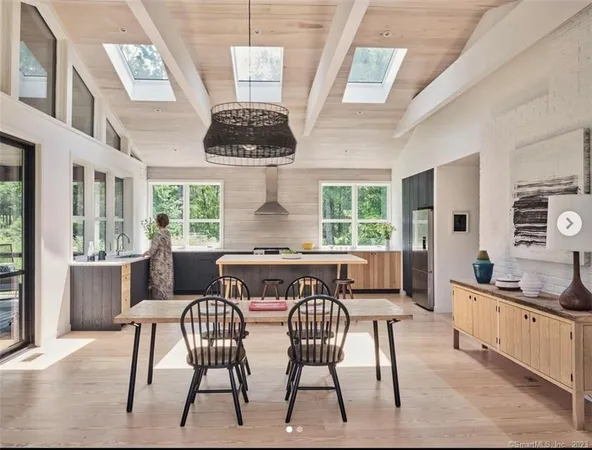 a view of a dining room with furniture window and outside view