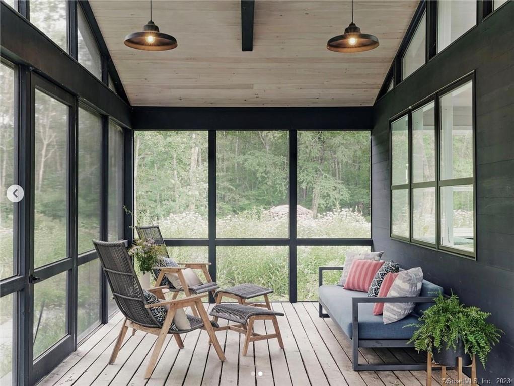 8 Chester Road Warren, CT 06754 - Photo 9 of 28 a living room with furniture and floor to ceiling windows