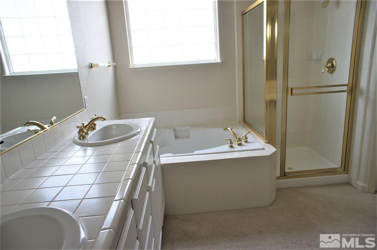 1075 Waverly Drive Reno, NV 89519 - Photo 10 of 17 a bathroom with a tub and a sink