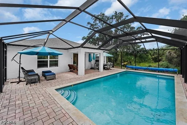a view of indoor pool and sitting area