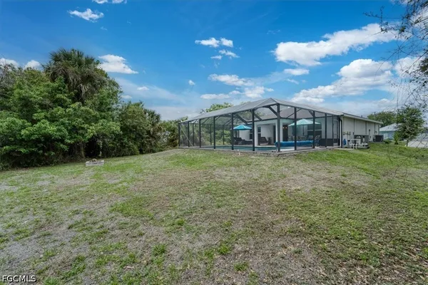 a view of a house with a big yard