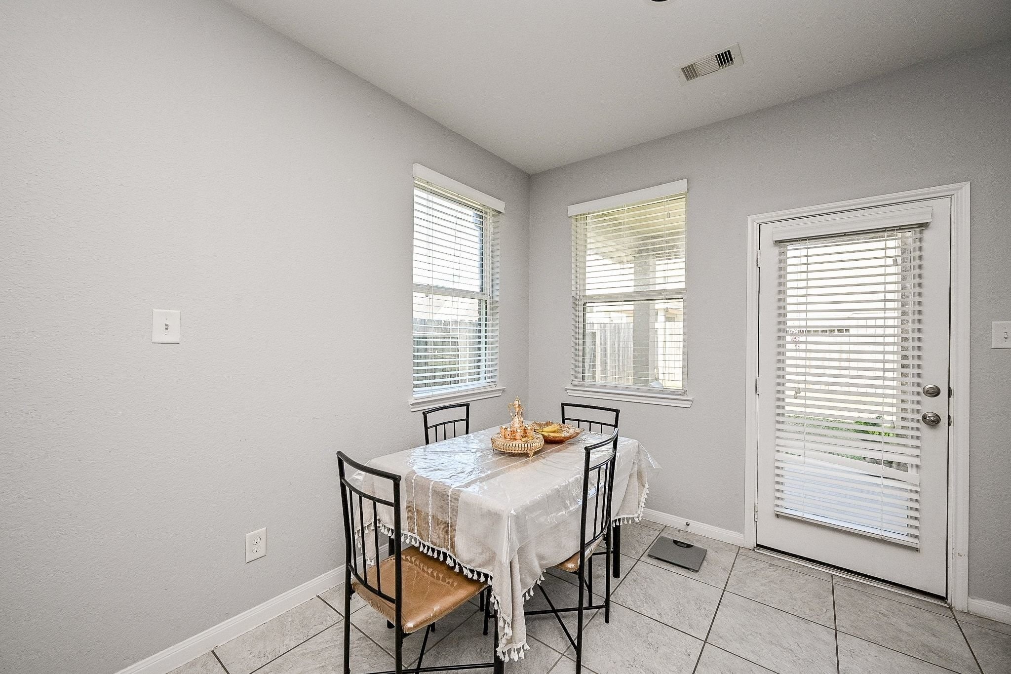 7042 Sliding Rock Circle Spring, TX 77379 - Photo 18 of 44 Cozy breakfast nook with abundant natural light, perfect for morning meals and intimate gatherings.