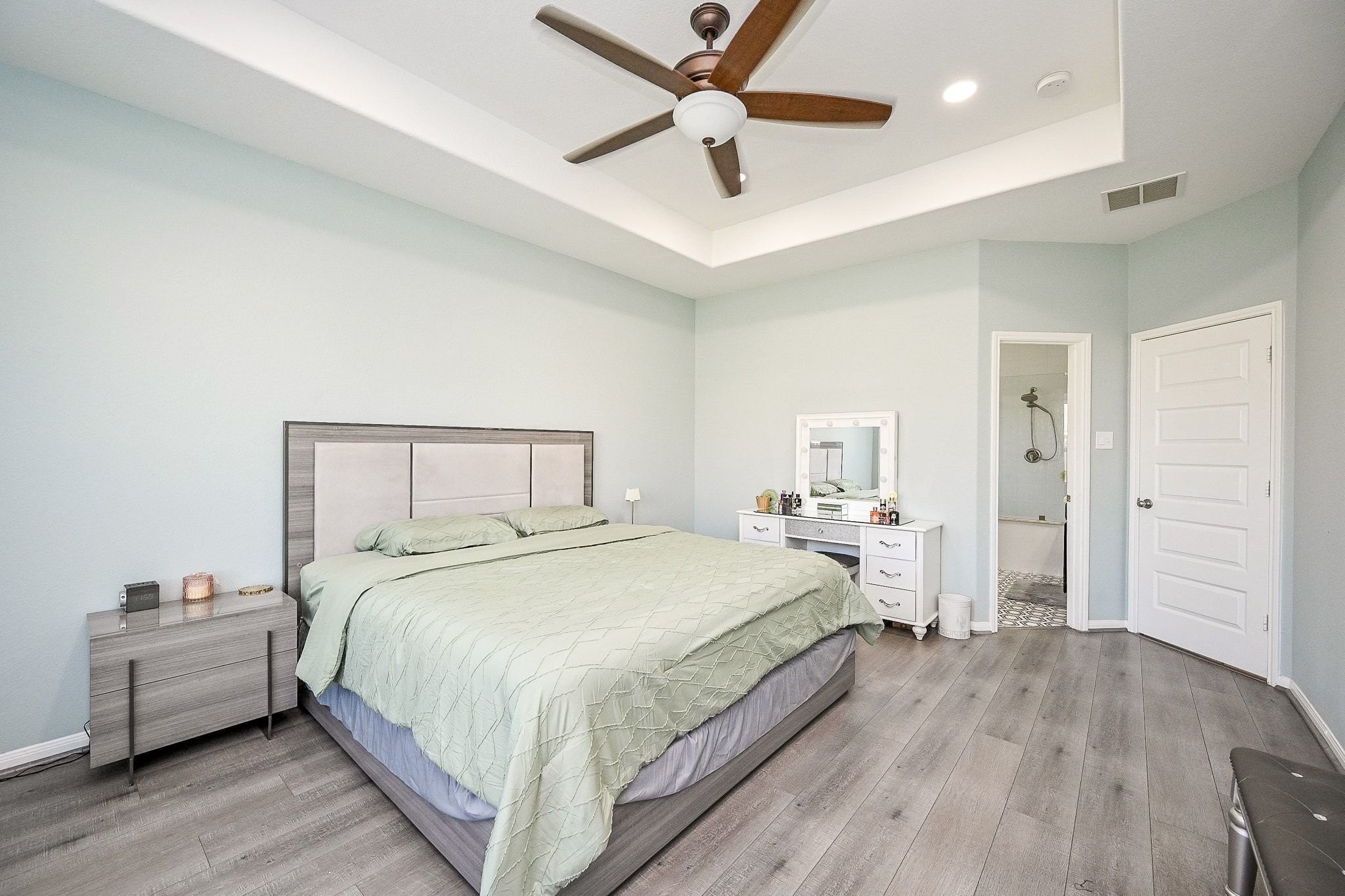 7042 Sliding Rock Circle Spring, TX 77379 - Photo 19 of 44 Luxurious primary suite with ample space for comfort and relaxation.