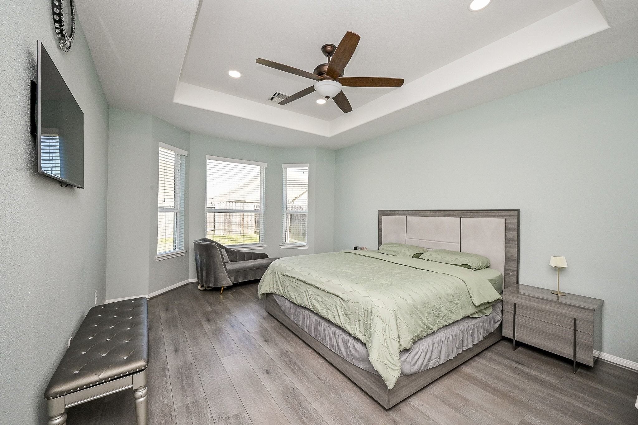 7042 Sliding Rock Circle Spring, TX 77379 - Photo 20 of 44 Expansive primary bedroom with ample natural light and modern design.