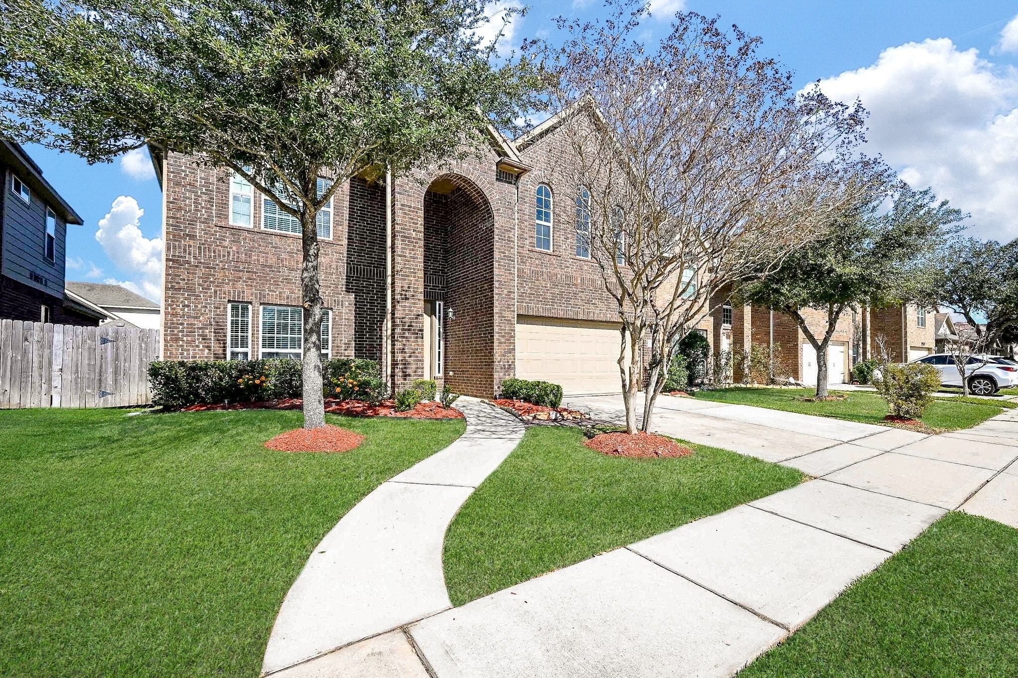 7042 Sliding Rock Circle Spring, TX 77379 - Photo 2 of 44 Charming front view showcasing elegant brickwork and a welcoming entryway.